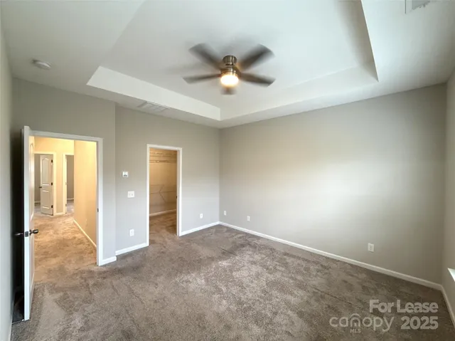 a bathroom with double vanity and a mirror