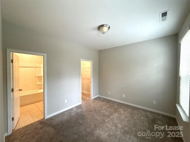 a bathroom with a granite countertop toilet a sink and bathtub