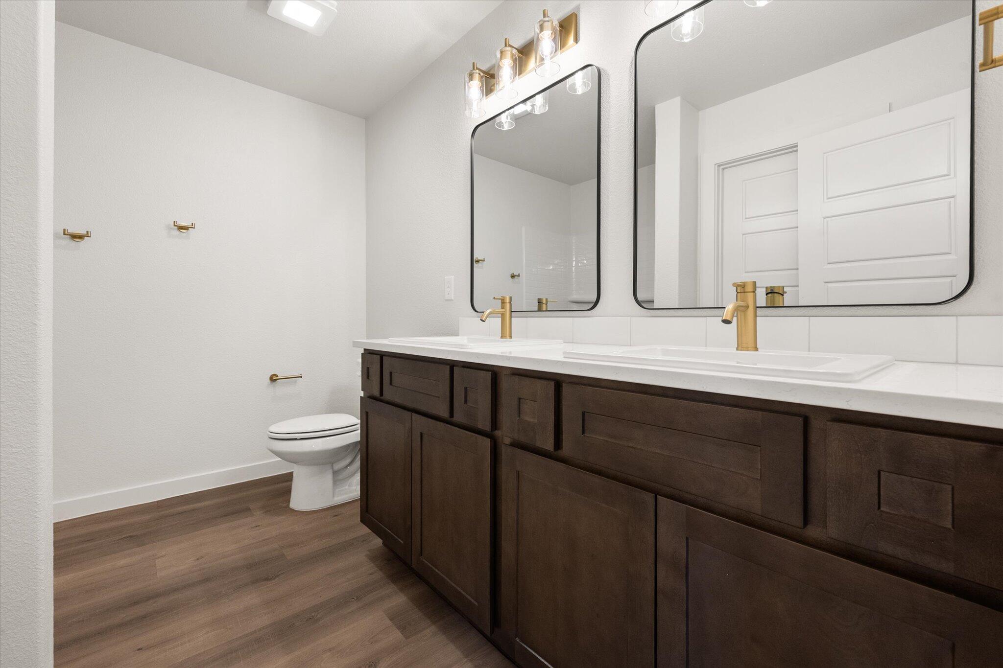 3102 138th Place Lubbock, TX 79423 - Photo 14 of 21 a bathroom with a sink and a mirror