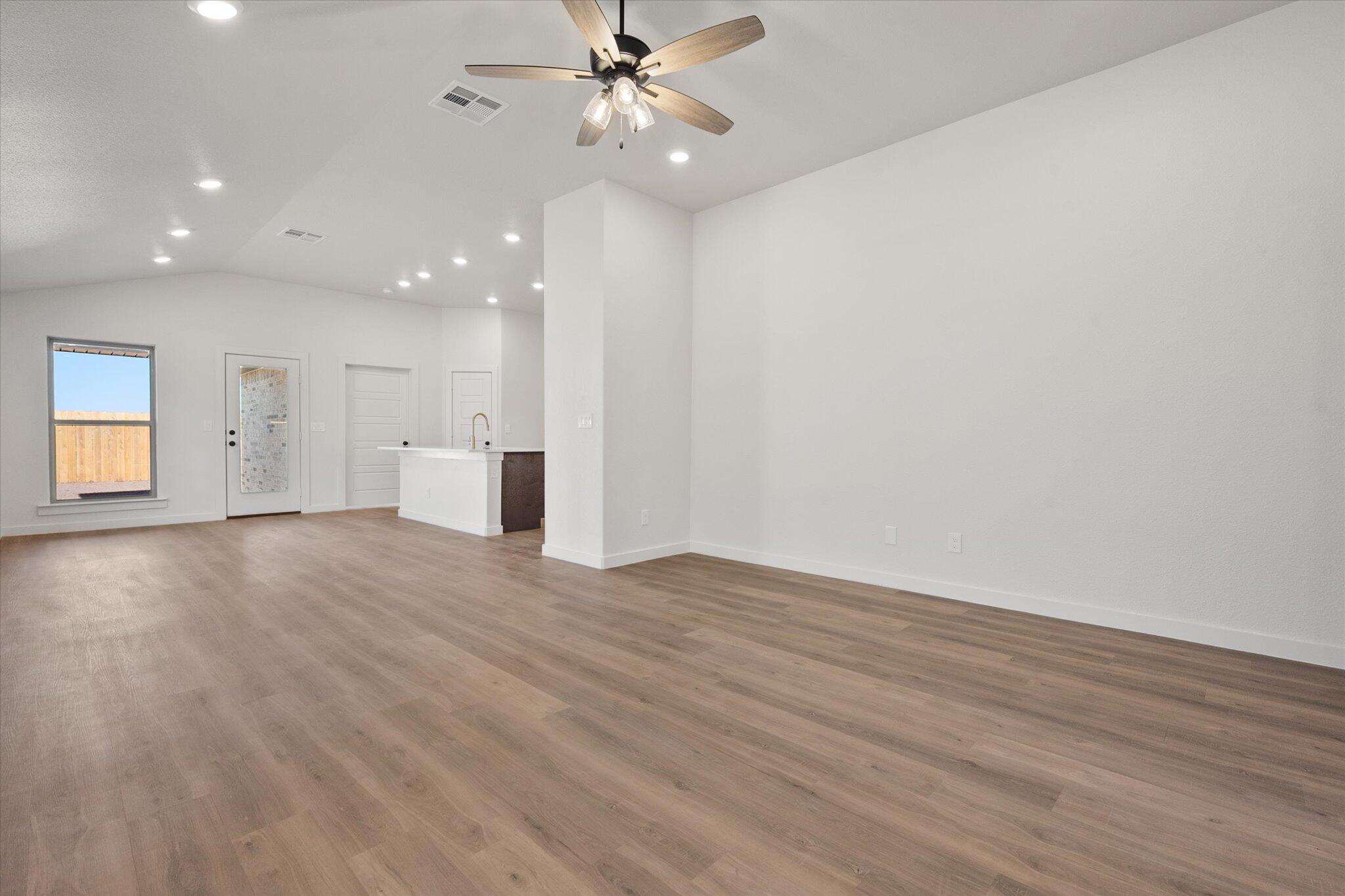 3102 138th Place Lubbock, TX 79423 - Photo 4 of 21 a view of an empty room with a window