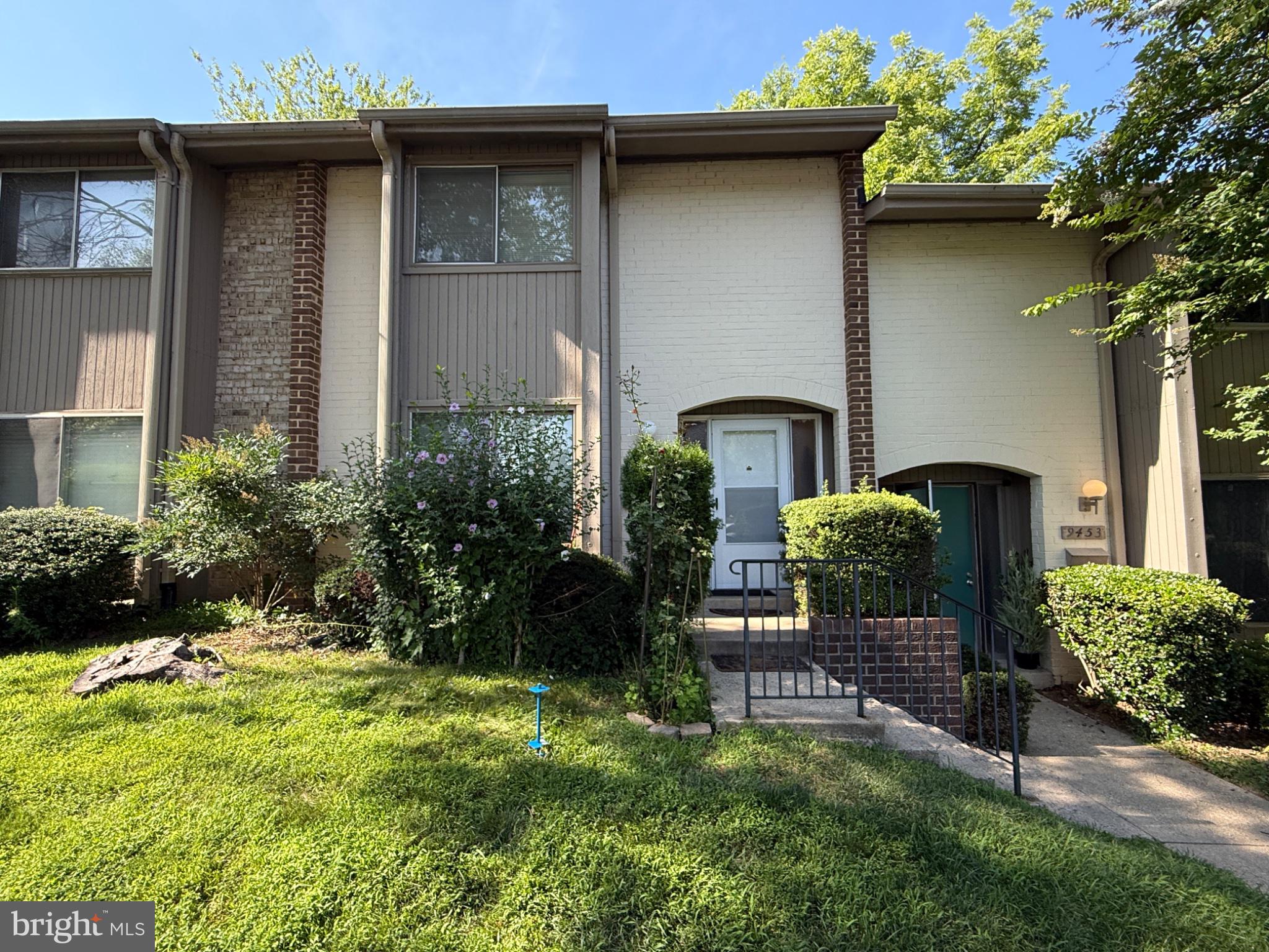 9455 Horizon Run Road, Unit 8 Gaithersburg, MD 20886 - Photo 2 of 25 Charming townhouse with lush greenery.