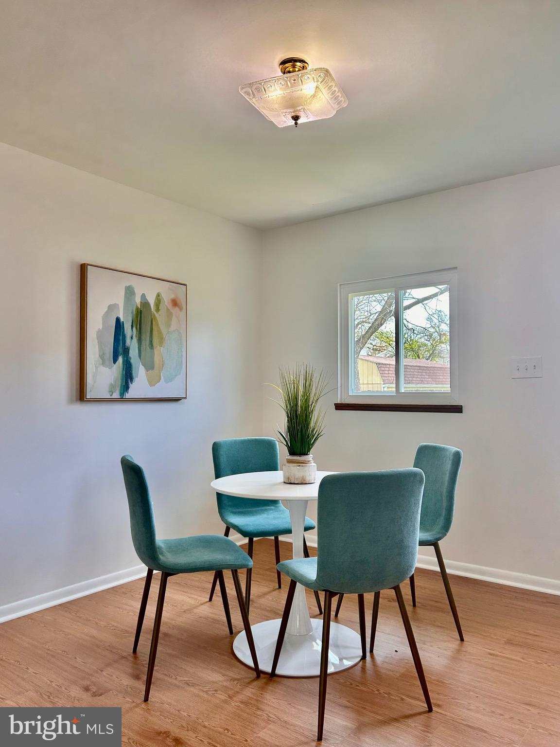 723 207th Street Pasadena, MD 21122 - Photo 21 of 42 a dining room with furniture and wooden floor
