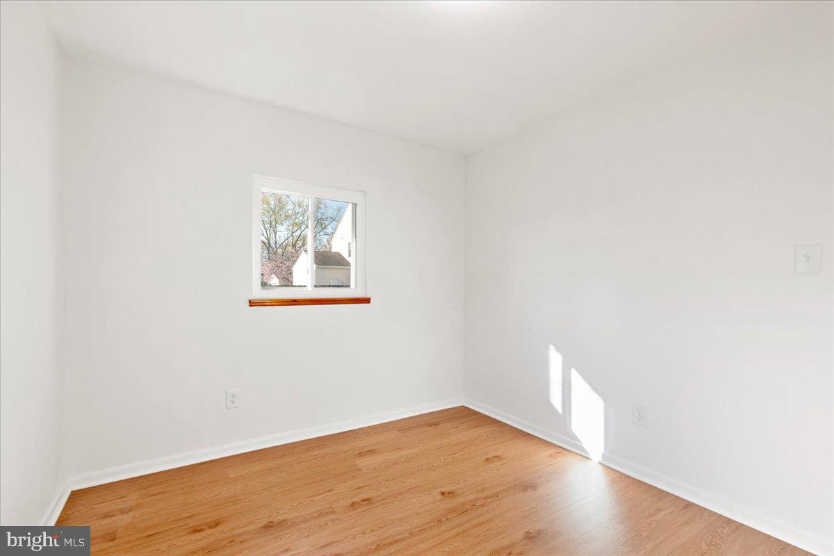 723 207th Street Pasadena, MD 21122 - Photo 28 of 42 a view of empty room with wooden floor
