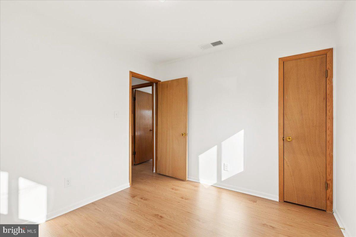 723 207th Street Pasadena, MD 21122 - Photo 29 of 42 a view of an empty room with wooden floor and closet