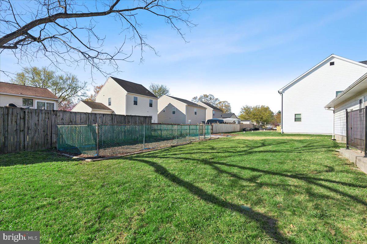 723 207th Street Pasadena, MD 21122 - Photo 42 of 42 a view of a backyard with wooden fence