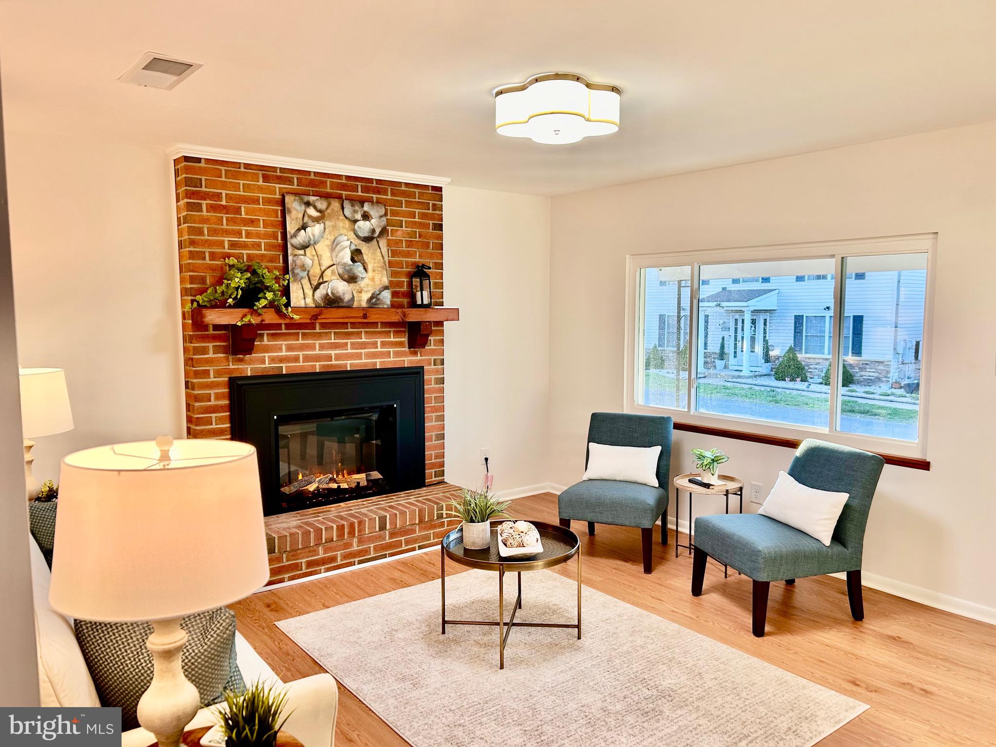 723 207th Street Pasadena, MD 21122 - Photo 7 of 42 a living room with furniture and a fireplace