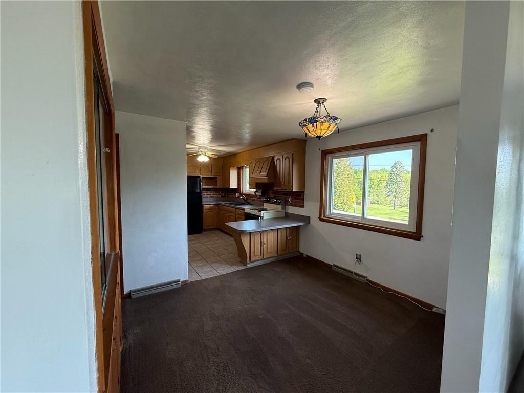 105 Ridgeview Drive Salix, PA 15952 - Photo 9 of 25 a open kitchen with a sink and dishwasher with wooden floor