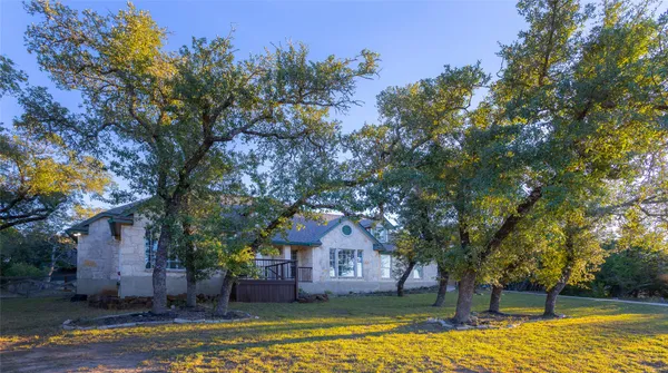 a house with a tree in the background