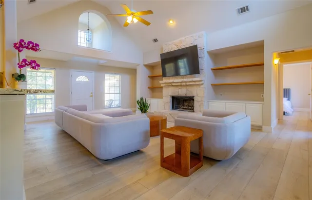 a living room with furniture and a fireplace