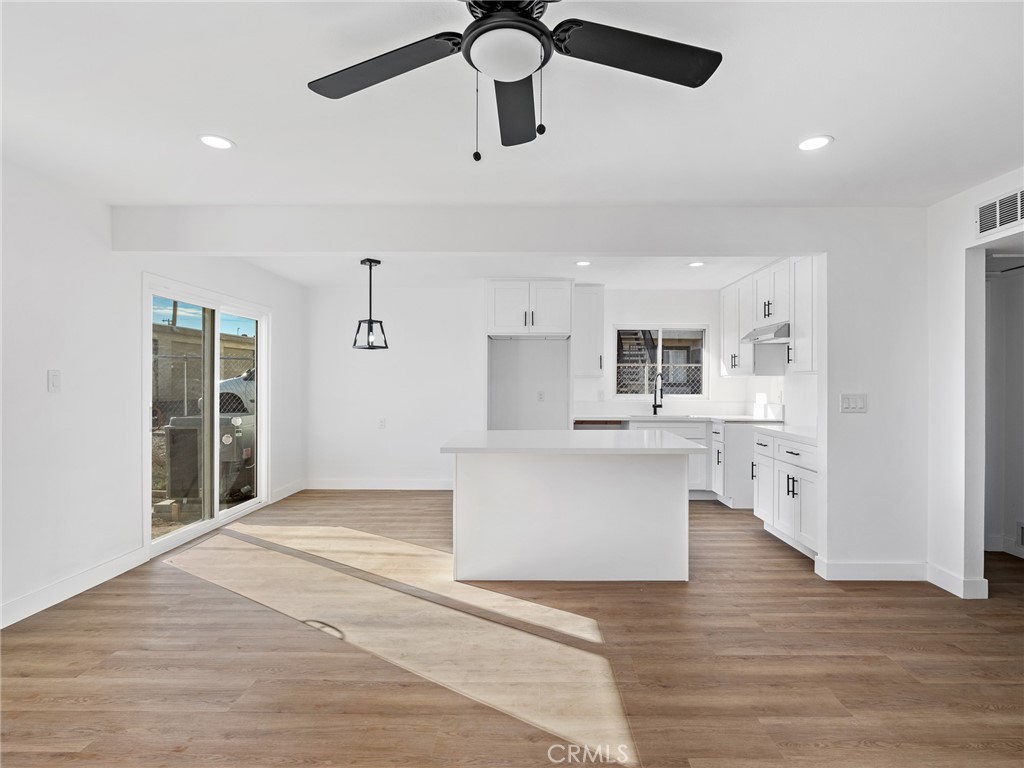840 East Virginia Way Barstow, CA 92311 - Photo 15 of 35 a view of kitchen with stainless steel appliances cabinets and wooden floor