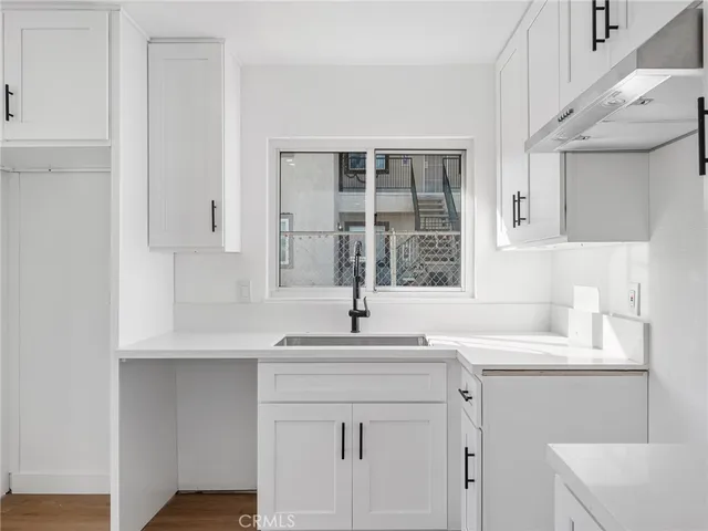 a bathroom with a sink toilet a mirror and shower