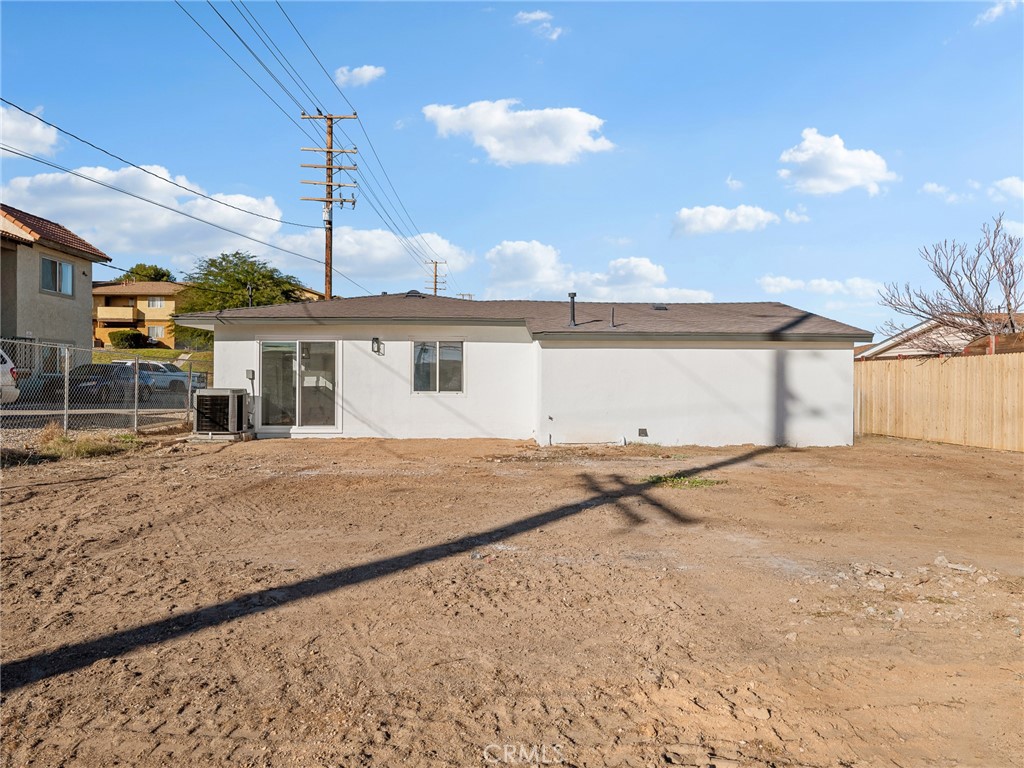 840 East Virginia Way Barstow, CA 92311 - Photo 31 of 35 a front view of a house with a yard and garage