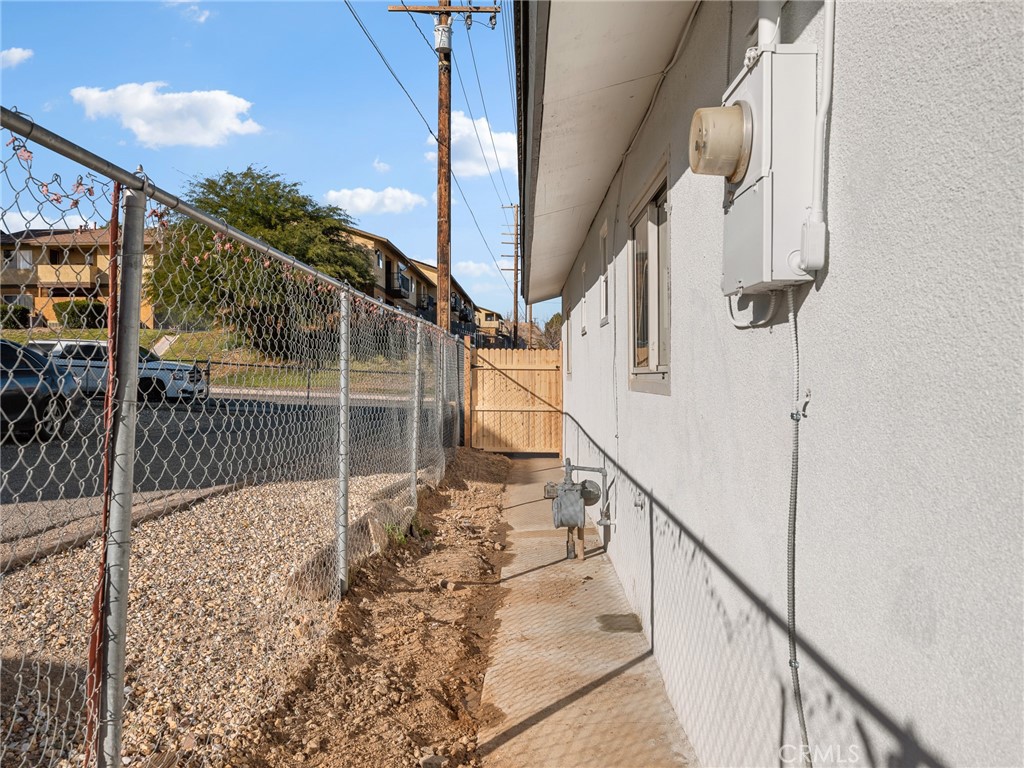840 East Virginia Way Barstow, CA 92311 - Photo 34 of 35 a view of staircase with railing and white walls