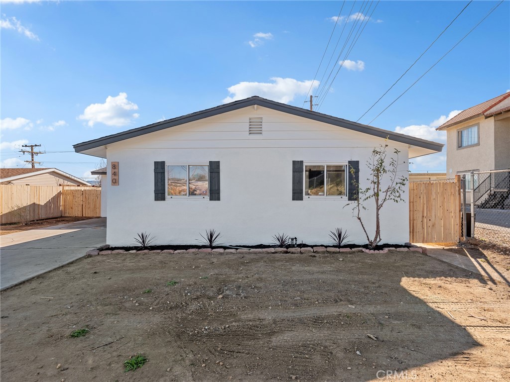 840 East Virginia Way Barstow, CA 92311 - Photo 4 of 35 a view of a house with a backyard