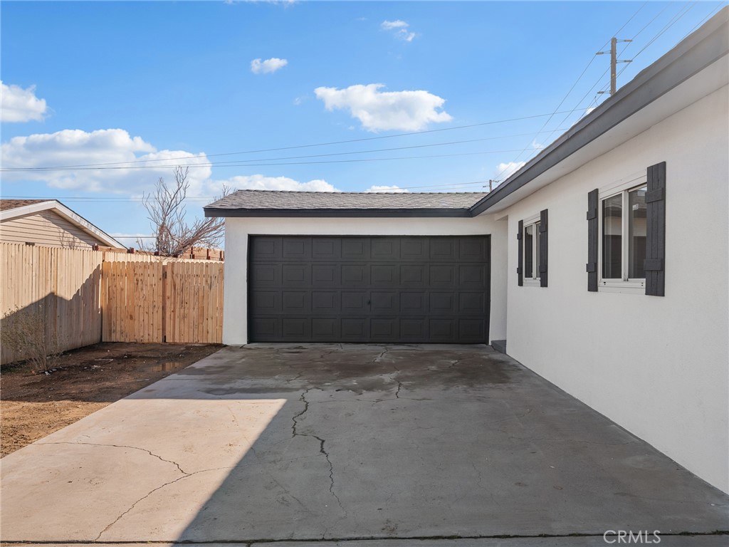 840 East Virginia Way Barstow, CA 92311 - Photo 6 of 35 a view of a house with a garage