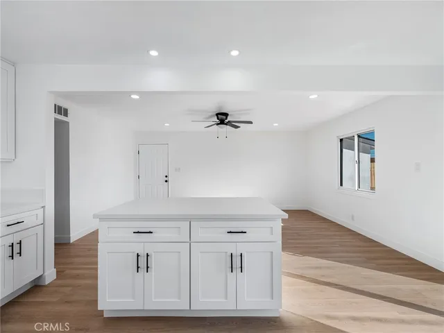 a view of a kitchen with electric appliances