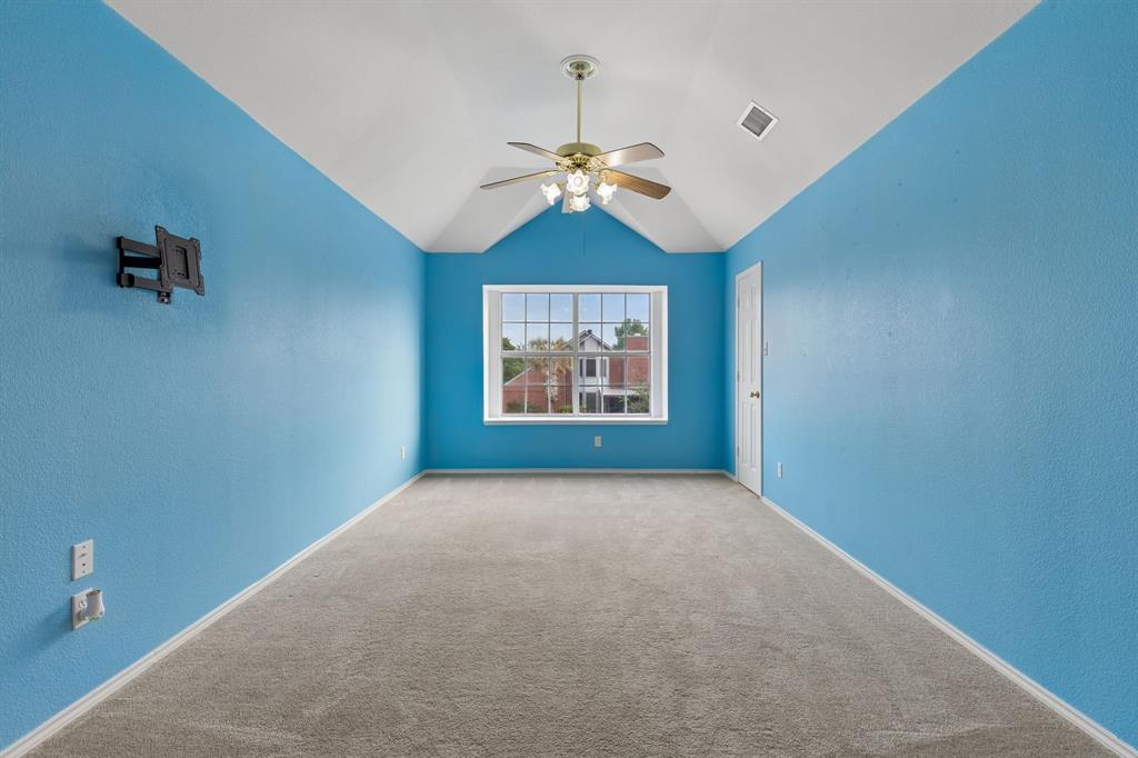 129 Timberbluff Lane Murphy, TX 75094 - Photo 26 of 34 an empty room with windows and fan