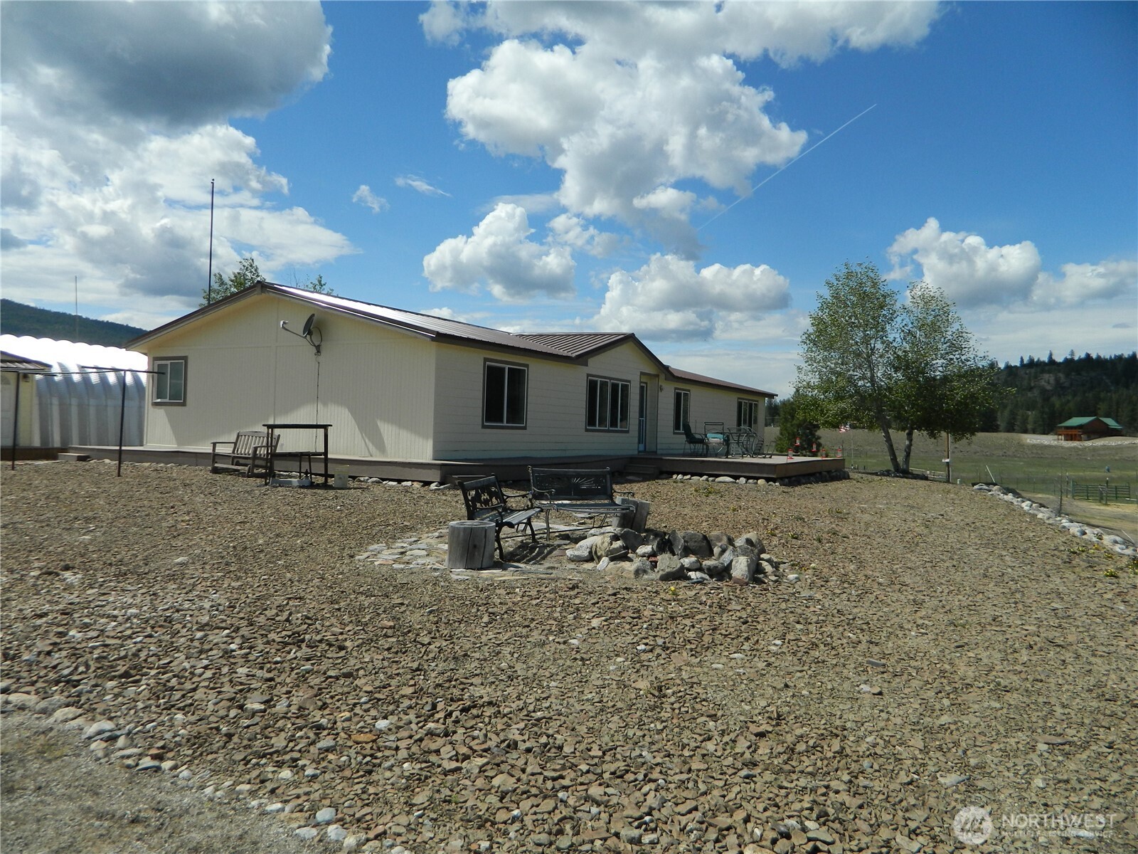 29 Duck Flats Road Tonasket, WA 98855 - Photo 12 of 25 a view of a house with a yard