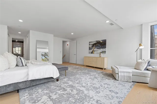 a bedroom with a bed and a couch