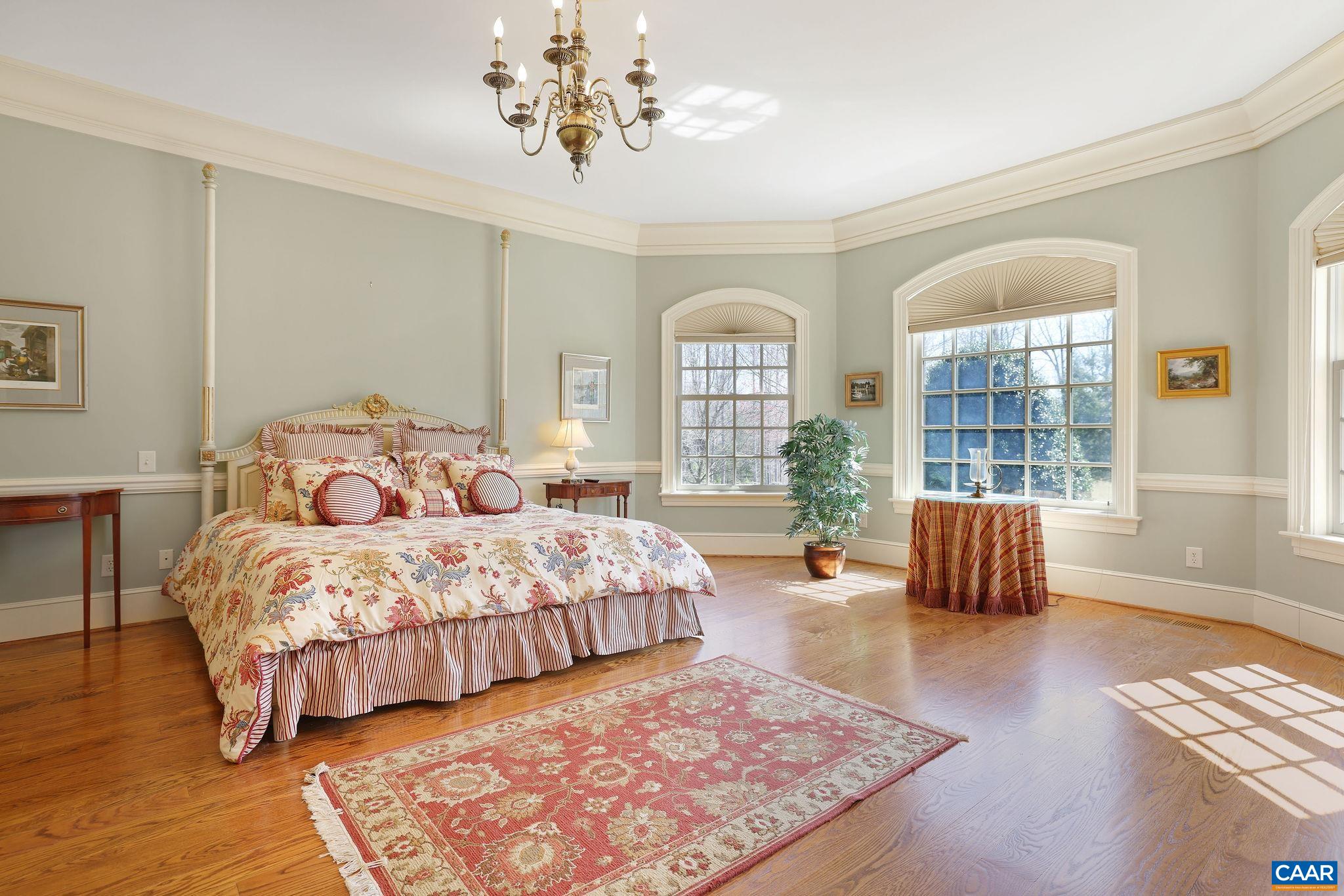 6385 Indian Ridge Drive Earlysville, VA 22936 - Photo 20 of 48 a spacious bedroom with two beds and a couch