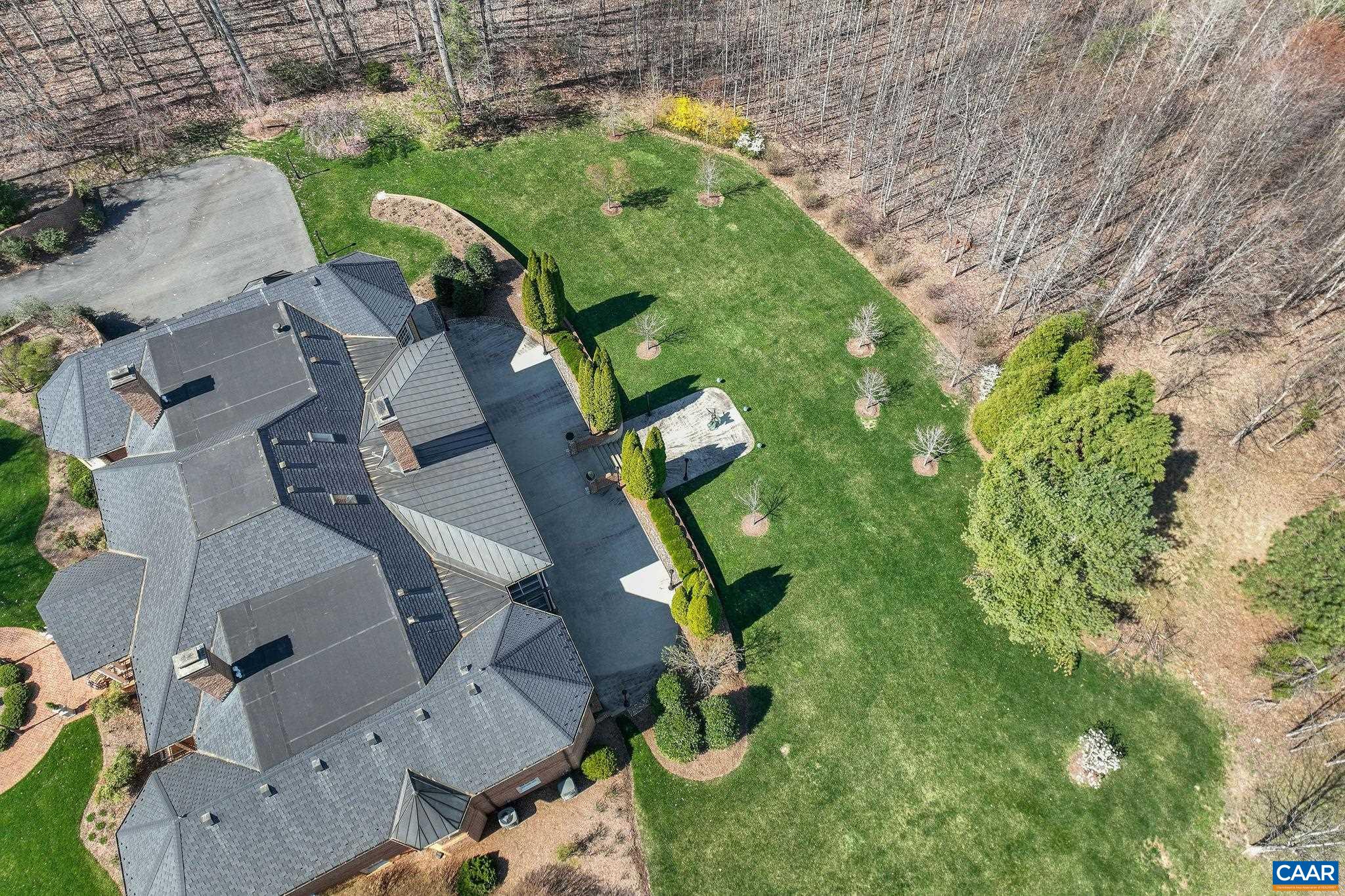 6385 Indian Ridge Drive Earlysville, VA 22936 - Photo 43 of 48 an aerial view of a house with a yard and lake view