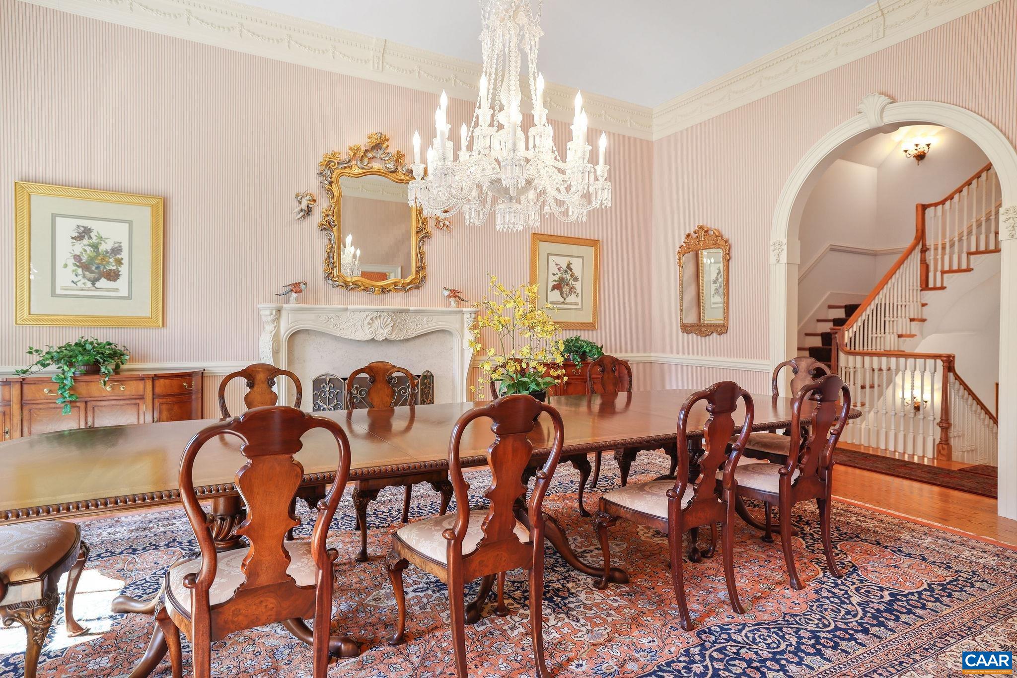 6385 Indian Ridge Drive Earlysville, VA 22936 - Photo 5 of 48 a view of a dining room with furniture and chandelier