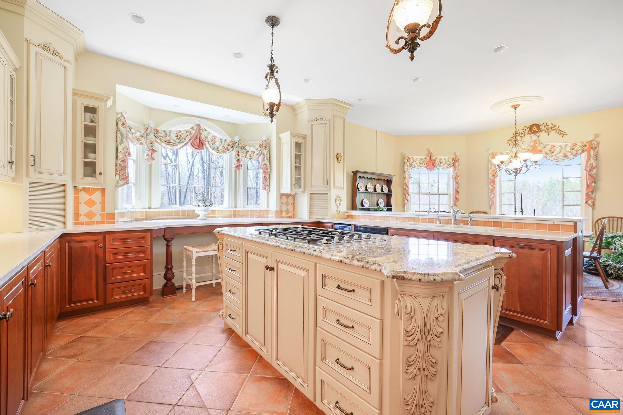 6385 Indian Ridge Drive Earlysville, VA 22936 - Photo 8 of 48 a kitchen with stainless steel appliances granite countertop a stove and a view of living room