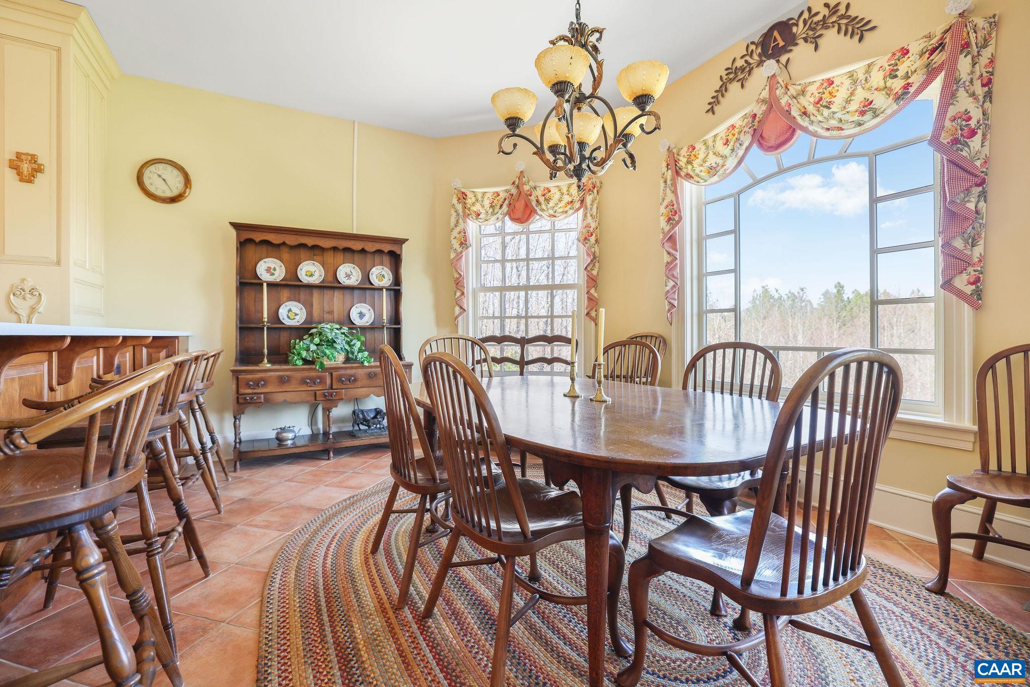 6385 Indian Ridge Drive Earlysville, VA 22936 - Photo 10 of 48 a view of a dining room and hall with furniture