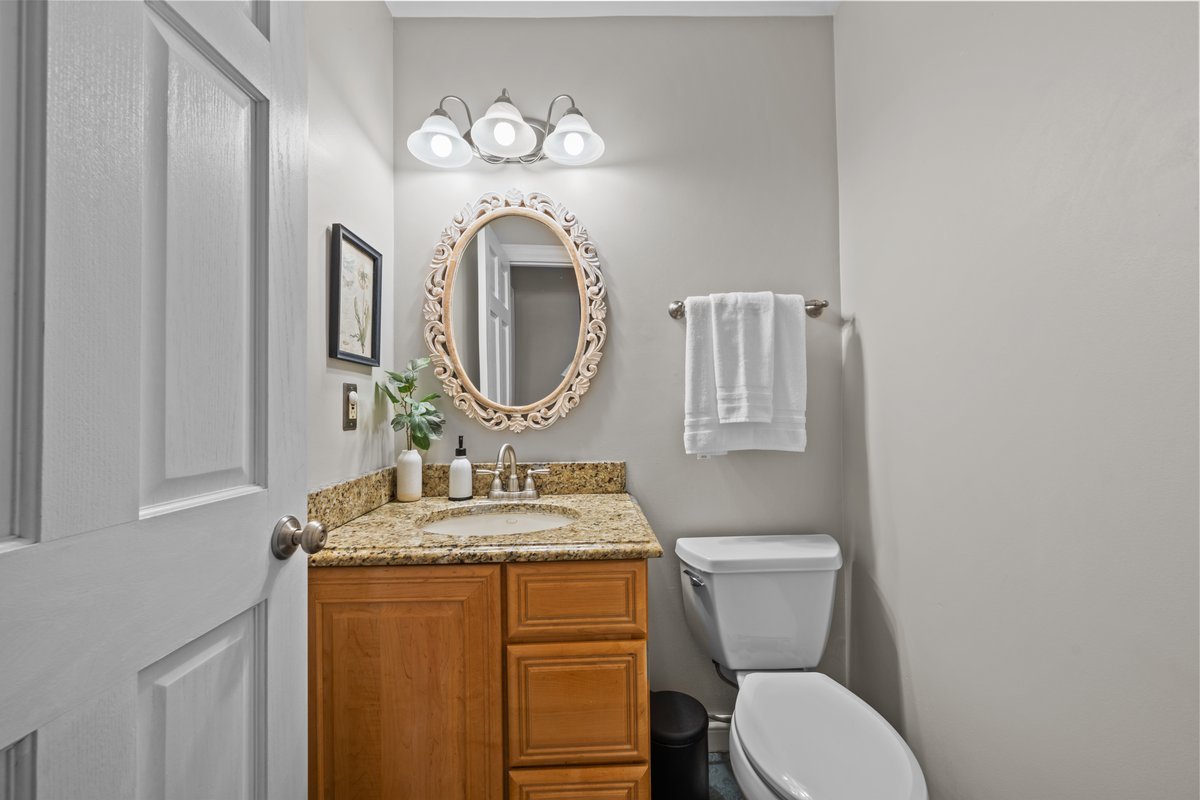 2115 Forest Ridge Road St. Charles, IL 60174 - Photo 15 of 25 a bathroom with a toilet sink vanity granite and mirror