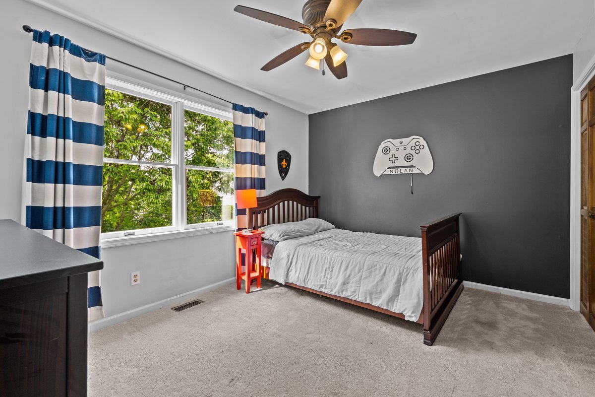 2115 Forest Ridge Road St. Charles, IL 60174 - Photo 18 of 25 a bedroom with a bed and a window