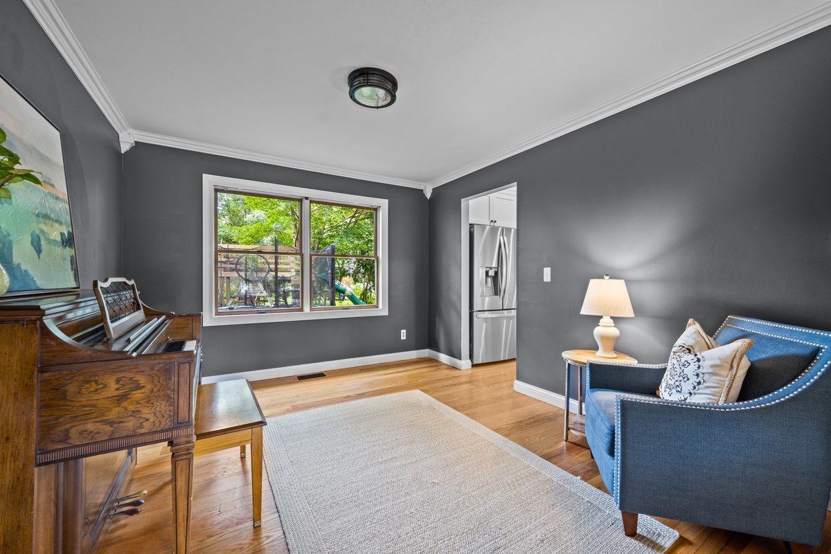 2115 Forest Ridge Road St. Charles, IL 60174 - Photo 3 of 25 a bedroom with a bed and dresser with mirror