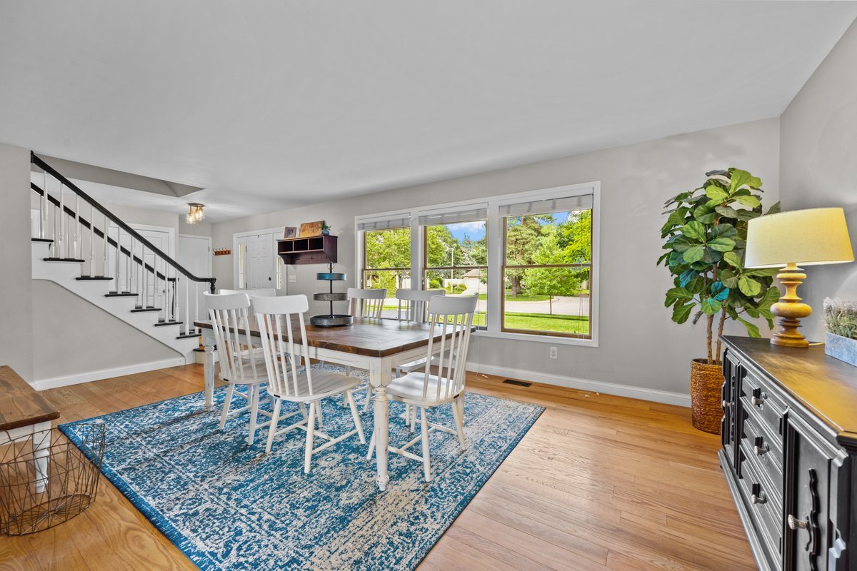 2115 Forest Ridge Road St. Charles, IL 60174 - Photo 5 of 25 a dining room with furniture a rug and a potted plant