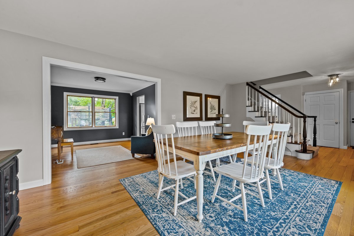 2115 Forest Ridge Road St. Charles, IL 60174 - Photo 6 of 25 a dining room with furniture a rug and wooden floor