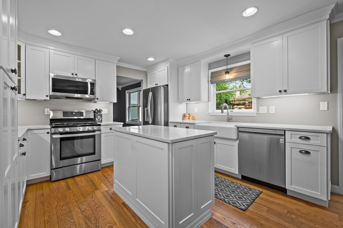 2115 Forest Ridge Road St. Charles, IL 60174 - Photo 8 of 25 a kitchen with white cabinets and appliances