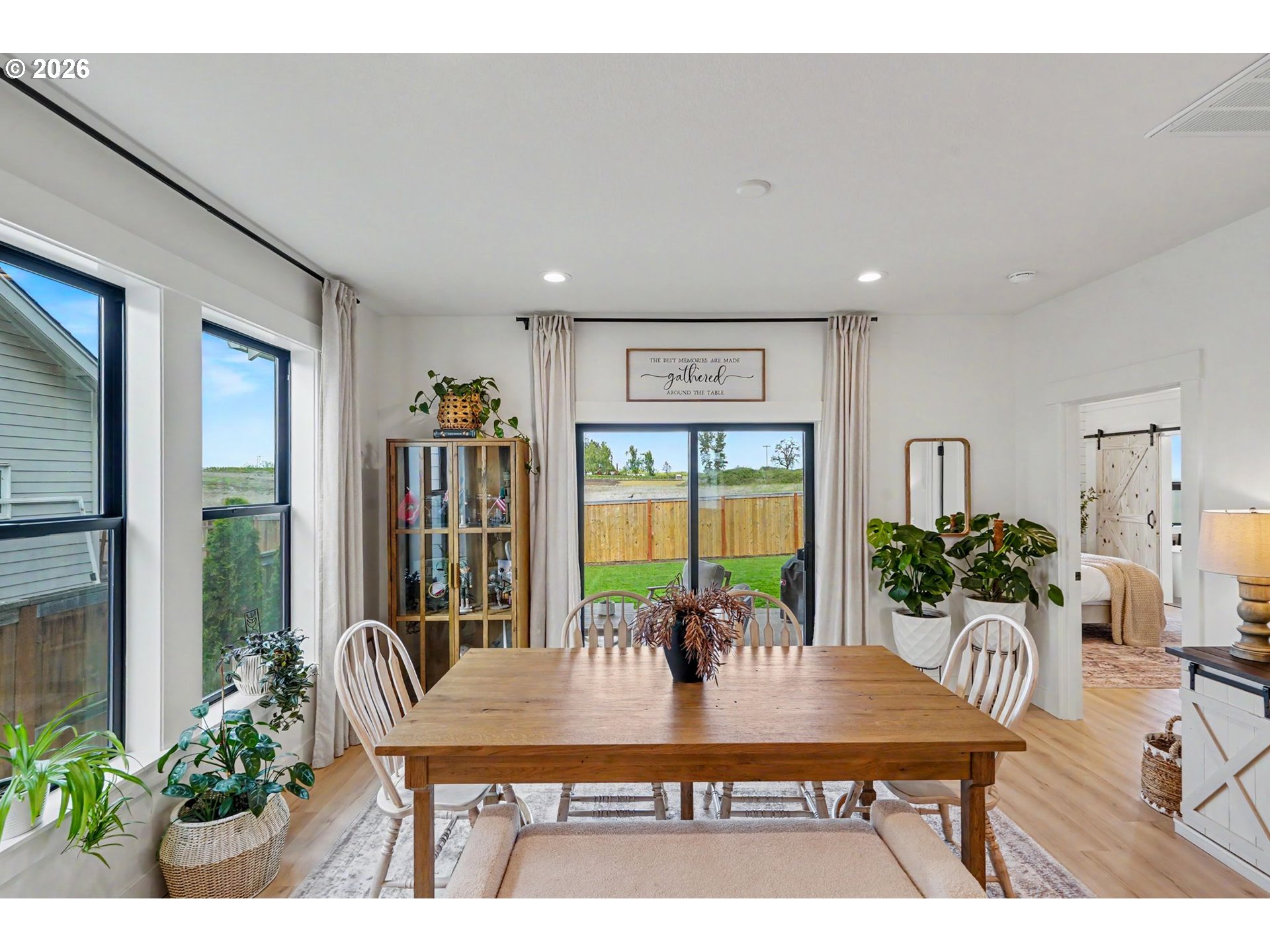 835 Reagan Street Mount Angel, OR 97362 - Photo 19 of 45 a view of a dining room with furniture and a potted plant