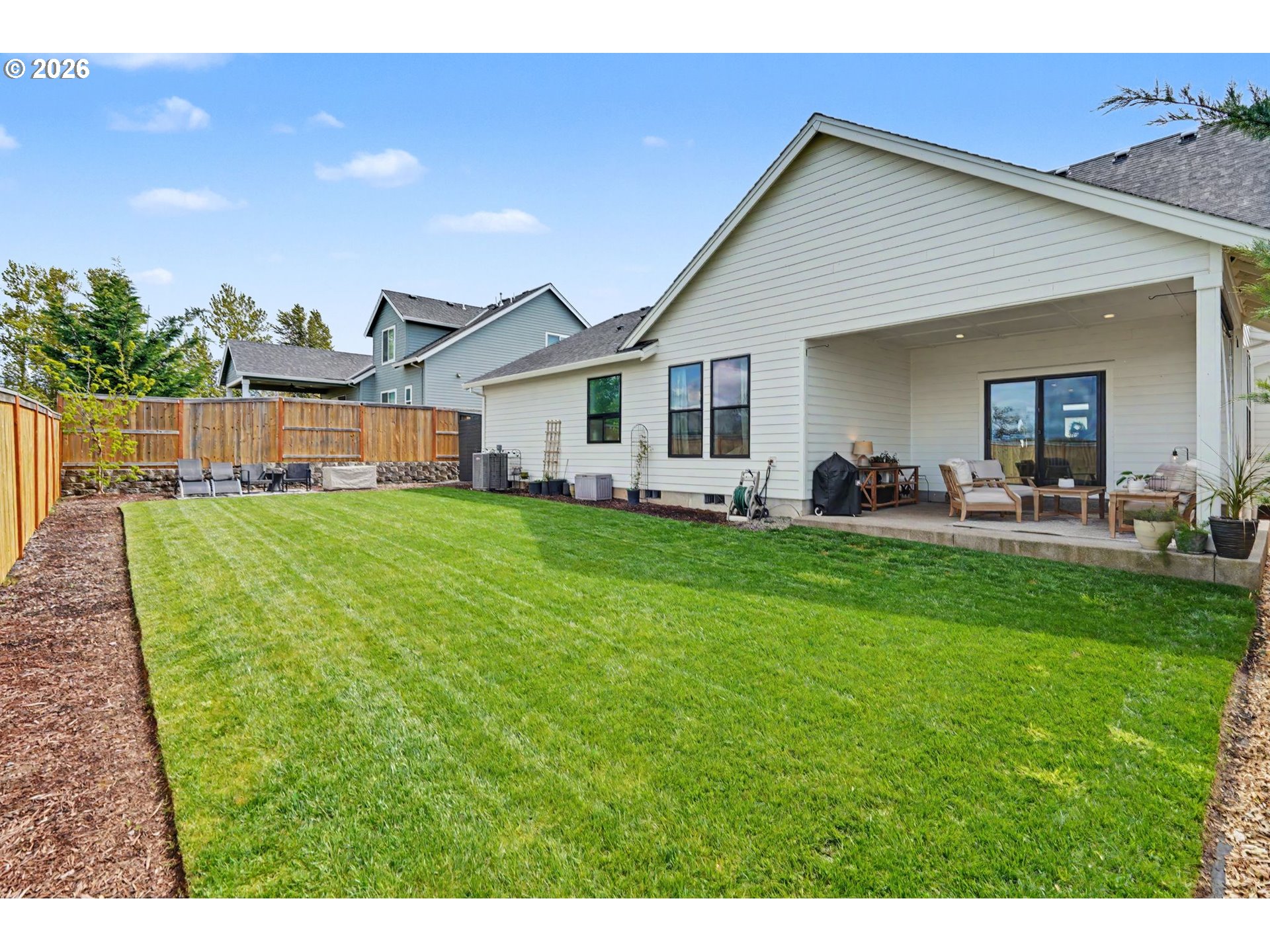 835 Reagan Street Mount Angel, OR 97362 - Photo 42 of 45 a view of a house with a backyard porch and sitting area