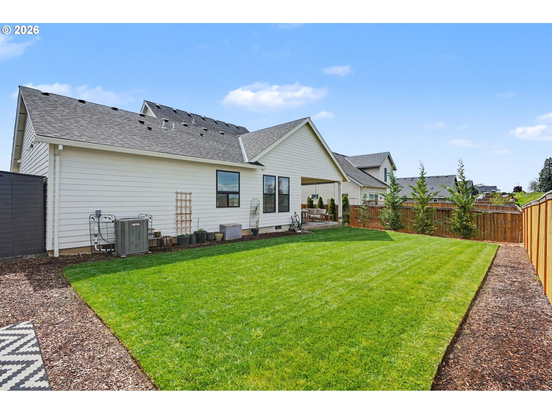 835 Reagan Street Mount Angel, OR 97362 - Photo 43 of 45 a view of a house with backyard porch and garden