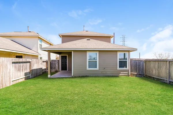 a view of kitchen with microwave and cabinets