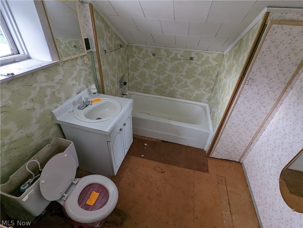 308 Thomas Road Lisbon, OH 44432 - Photo 11 of 13 Full bathroom featuring tiled shower / bath, vanity, and toilet