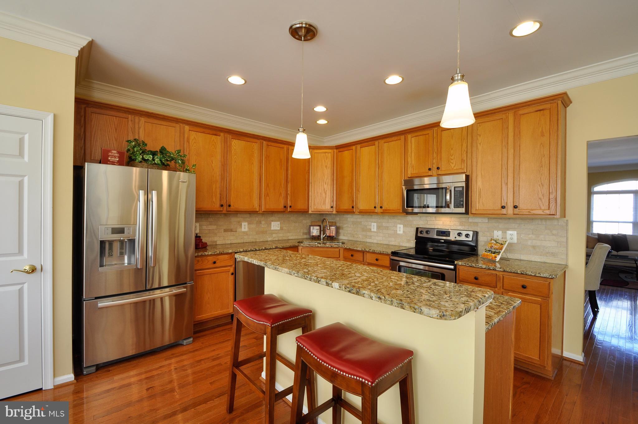 7332 Hampton Manor Place Springfield, VA 22150 - Photo 12 of 30 Breakfast bar at kitchen island