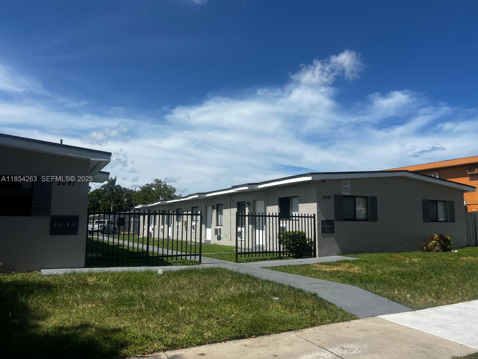 2090 Northwest 31st Street, Unit 2 Miami, FL 33142 - Photo 1 of 10 a view of a house with backyard and porch