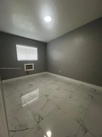 a view of room with projector and screen