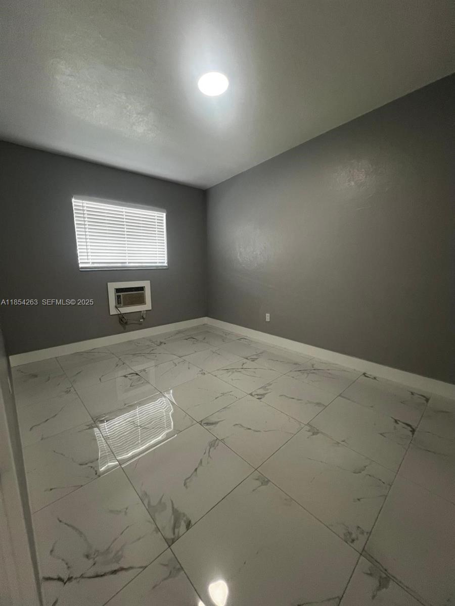 2090 Northwest 31st Street, Unit 2 Miami, FL 33142 - Photo 3 of 10 a view of room with projector and screen