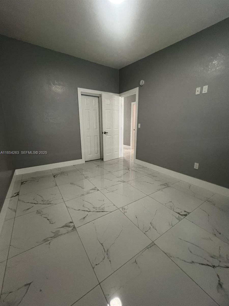 2090 Northwest 31st Street, Unit 2 Miami, FL 33142 - Photo 7 of 10 a view of an empty room