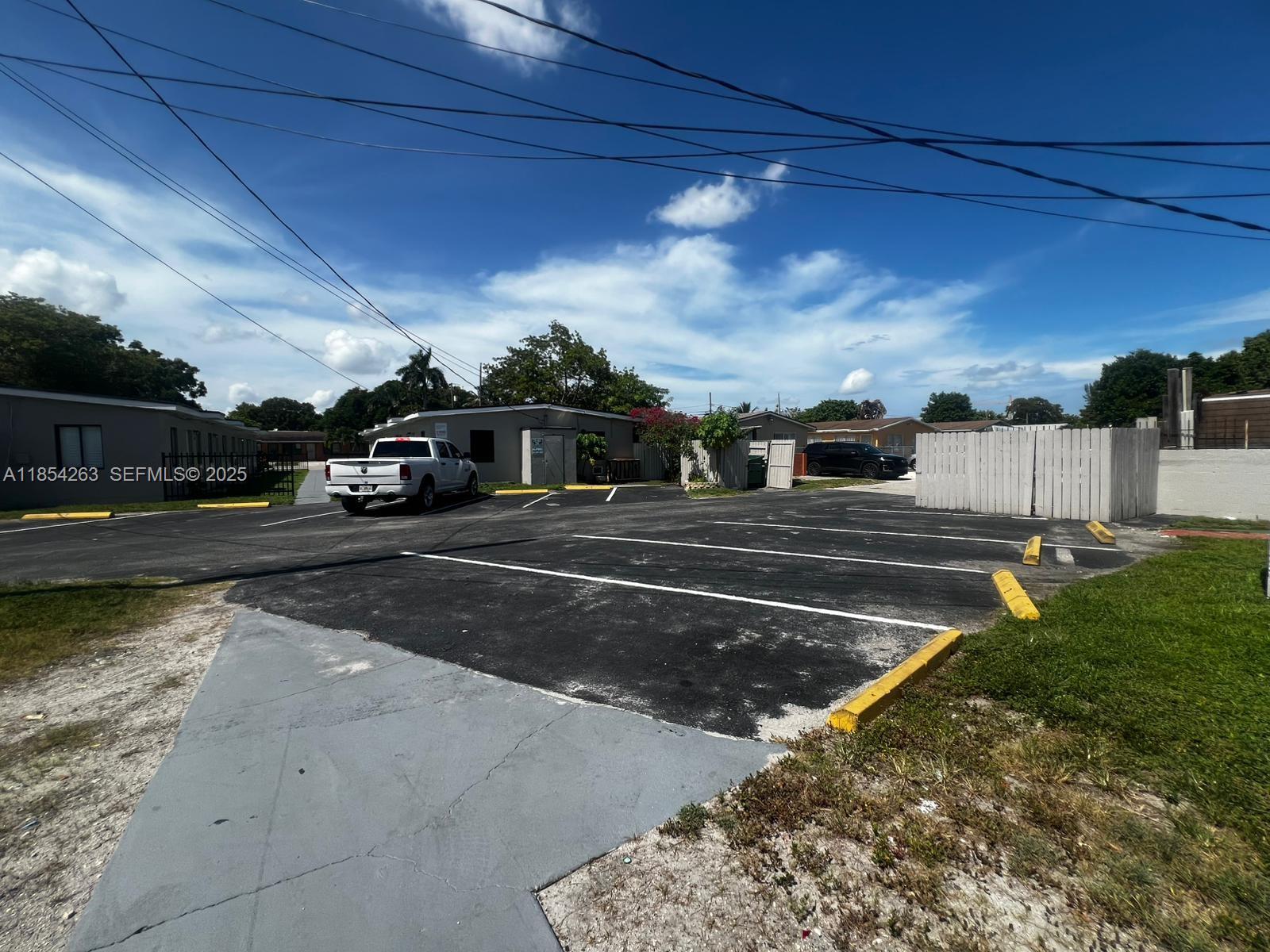 2090 Northwest 31st Street, Unit 2 Miami, FL 33142 - Photo 10 of 10 a view of a street with houses