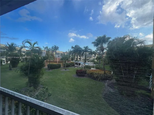 a view of a garden from a balcony
