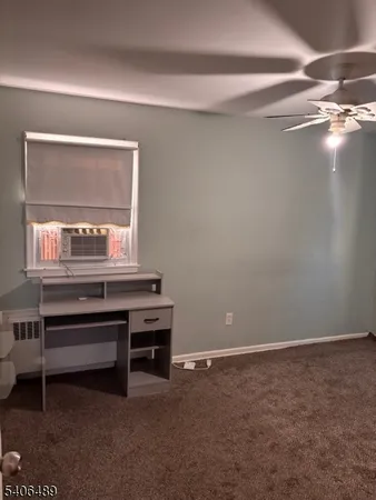 a room with a desk and a window