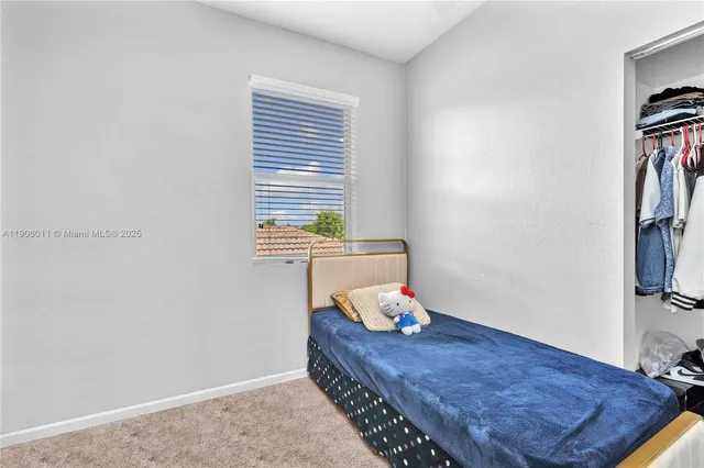 a room with a bed and a window