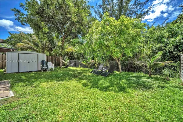 a backyard of a house with lots of green space
