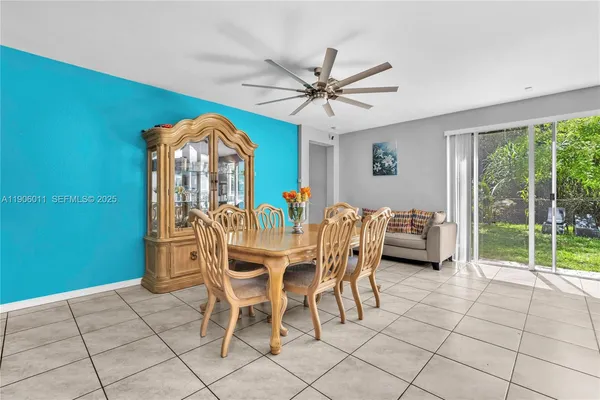 a dining room with furniture and window
